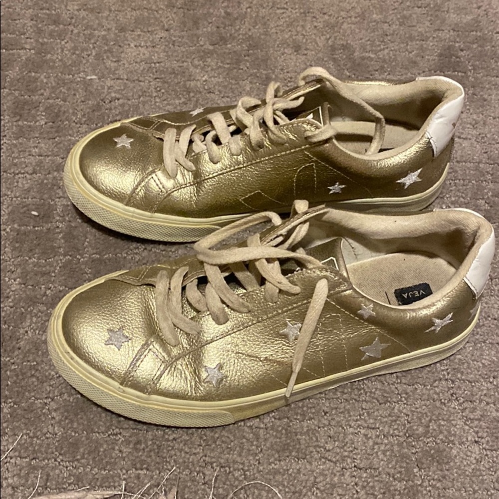 Gold woman’s Veja x Madewell star sneakers